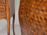 a wooden cabinet with a drawer on top of it