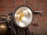 a close up of a motorcycle with a light on it