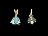 a pair of blue topaze and diamond earrings on a black background