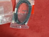 a close up of a cable in a plastic bag on a red surface