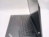 a laptop that is open on a white surface