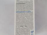 a close up of a box of toothpaste on a white surface