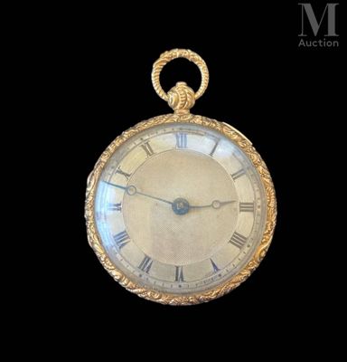 a gold pocket watch with roman numerals on the face