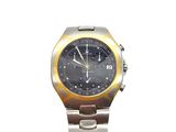 a silver and gold watch with a black face
