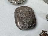 a lot of silver objects that are on a table