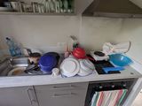 a kitchen with a sink and a dishwasher in it