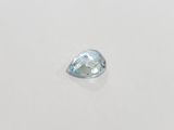 a close up of a white diamond on a white surface
