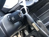 a close up of a car ' s interior with a remote control