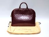 an image of a louis vuitton handbag on a cloth
