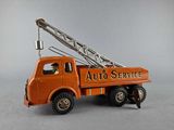 an orange toy truck with a crane on it