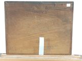 a picture of a box with a piece of wood on top of it