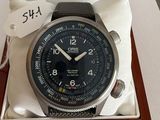 a watch that is in a box with a tag on it