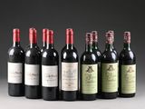 several bottles of wine are lined up in a row