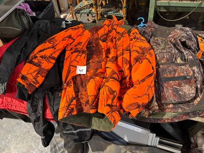 a pile of hunting gear sitting on a table