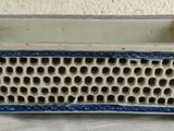 a blue and white planter with holes in it