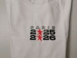 a white t - shirt with a red star on the front of it