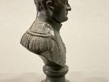 statue of a bust of a man wearing a suit and tie