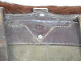 a close up of a horse ' s saddle with a leather belt