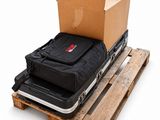 two suitcases sitting on top of a pallet on a pallet
