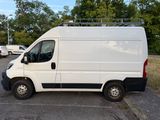a white van that is parked in a parking lot