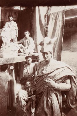 a black and white photo of a group of people in a room