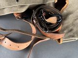 a bag with a belt and a pair of scissors in it