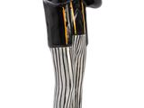 figurine of a baseball player with a bat on a wooden base