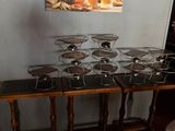 a table that has a bunch of glasses on top of it