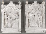 two white sculptures of jesus carrying the cross and a woman carrying the cross
