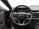 the interior of a car with a steering wheel and dashboard controls
