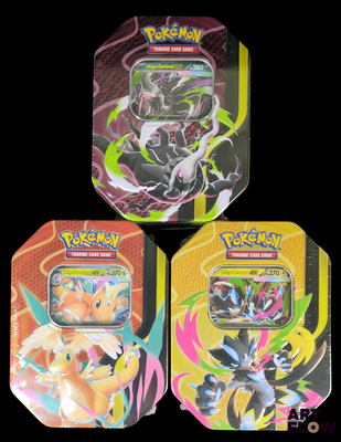 three tins of pokemon trading cards are shown on a black background