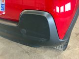 a close up of a red car with a license plate on it