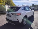 a white car that is parked in the parking lot