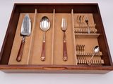 a wooden tray with silverware and utensils in it