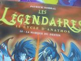 une photo d'un livre sur laquelle figurent deux personnages d'anime