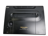 a black nintendo game console sitting on top of a table