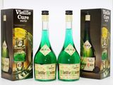 three bottles of wine sitting next to each other in front of a box