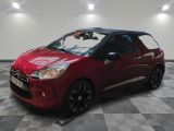 the red citrole is parked on a checkered floor