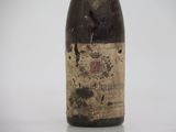 a bottle of wine that is sitting on a table