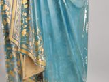 an image of a statue of a woman in a blue dress