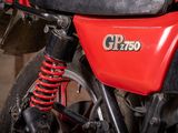 a close up of a red motorcycle with a black seat