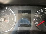 a close up of a car dashboard with a speedometer and gauges