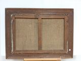 an old wooden easel with a burlocked window on top of it