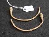 a gold plated necklace with a snake ' s head on it