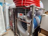 a metal cart with a bunch of hoses on top of it