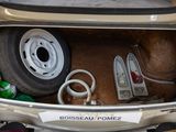 a small car with a lot of stuff inside of it