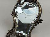 a mirror that is sitting on top of a table