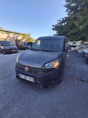 a black van parked in a parking lot next to other cars