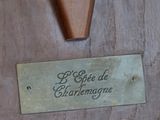 a plaque on the door of a building with a knife in it