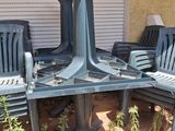 many chairs and a table on the patio